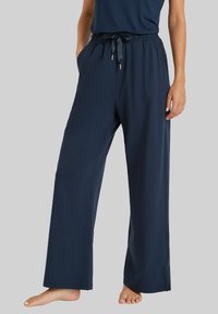 Marineblauwe loungebroek van zachte, rekbare stof, met een elastische tailleband met een trekkoord en zijzakken.