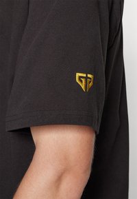 Puma Triko s potiskem - black