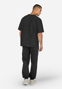 Pegador JOGGING - Træningsbukser - schwarz