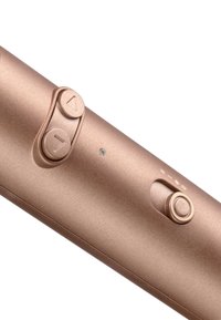 Oplaadbaar metallic rosegouden apparaat met twee driehoekige knoppen en een ronde schuifschakelaar op een gladde cilindrische oppervlakte.