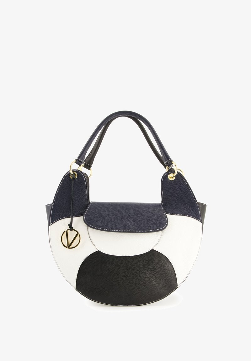 Circular handbag featuring navy, white, and black leather sections, a textured finish, gold-tone hardware, and a top handle.