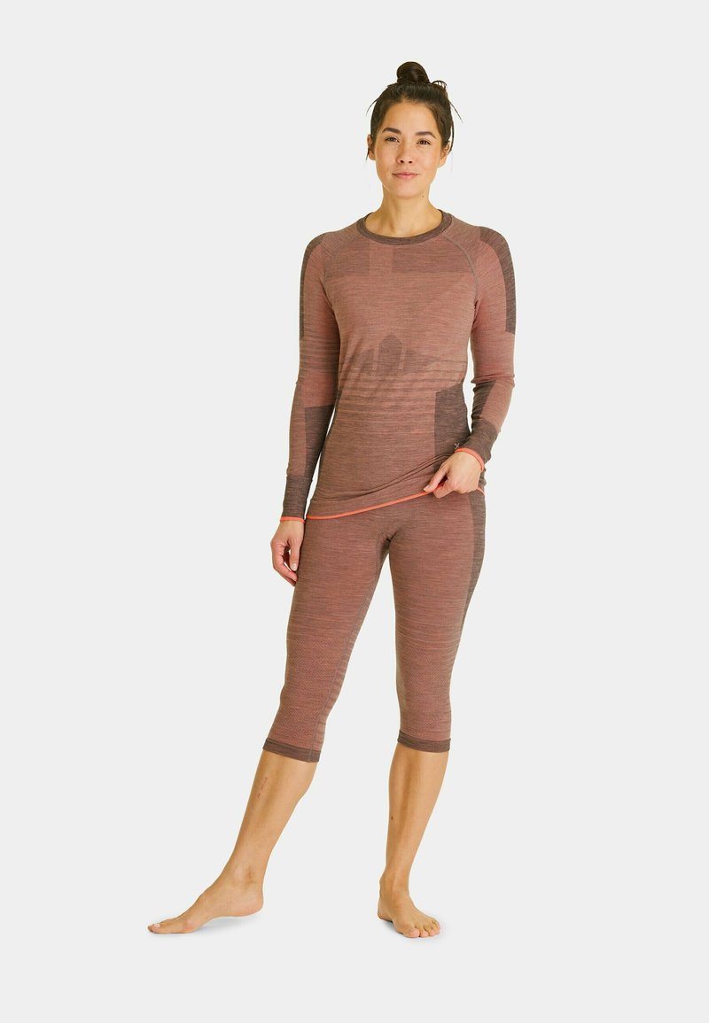 Long-sleeve top and capri leggings in muted reddish-brown, featuring textured stripes and contrasting darker accents. No visible logos.