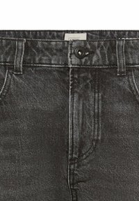 Black denim jeans with a faded finish, featuring a button closure, front pockets, and belt loops. The texture appears smooth and durable.