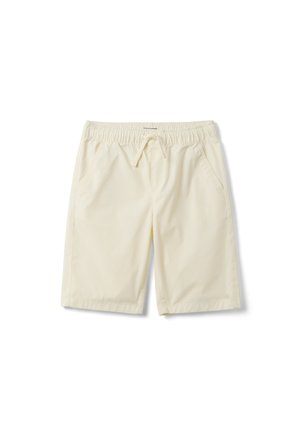 Shorts beige clair jusqu'aux genoux avec taille élastique, cordon de serrage et poches latérales, étalés à plat sur fond blanc.