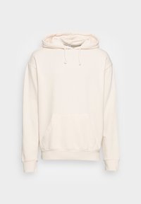 Krémová mikina s kapucí, přední kapsou, žebrovanými manžetami a lemem, vyrobená z měkké tkaniny, s šňůrkami u výstřihu.