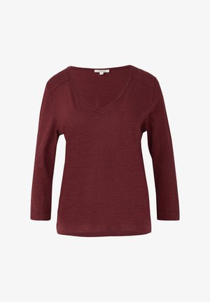 Burgundy long-sleeve top with a V-neckline, made from soft, textured fabric. Features slightly dropped shoulders and a relaxed fit.