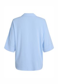 Light blue, short-sleeve blouse with a loose fit and a collar, shown from the back against a white background.