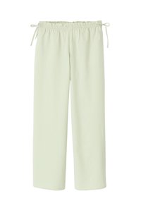Pantalons à motifs de couleur vert clair, ample, avec une taille élastique et des fermetures à nouer sur les côtés ; présente un petit motif à carreaux.
