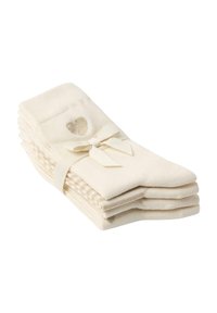 Sæt af krémfarvede sokker med en blød tekstur, prydet med et lille glitrende hjerte-design og bundet med et bånd. Fem par pænt stablet.