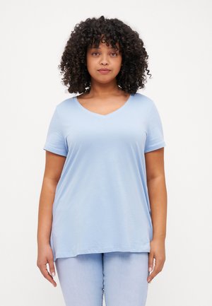 Light blue, short-sleeve V-neck t-shirt, made from soft fabric, with a relaxed fit and smooth texture, paired with light jeans.