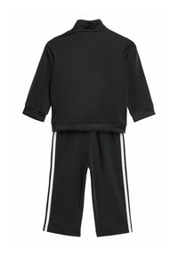 Black athletic tracksuit made of smooth fabric; features a zip-up jacket with short sleeves and matching pants with white side stripes.