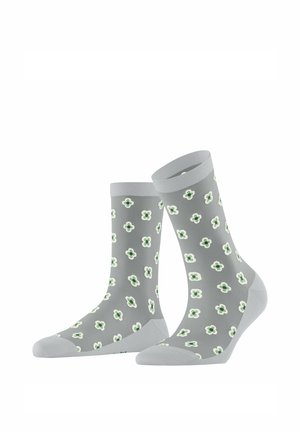 Chaussettes grises mi-mollet avec un motif de fleurs à quatre pétales en vert clair et blanc, présentées côte à côte sur un fond blanc.