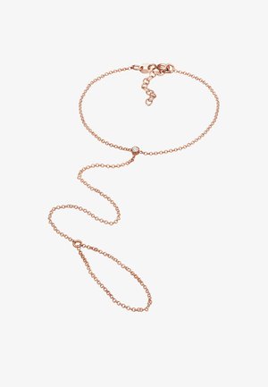 Rose gold kædearmbånd med en central klar ædelsten, der har et delikat, let design og justerbar lås.