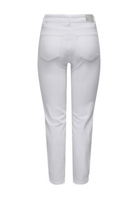 Vita denimjeans sedda bakifrån, med två bakfickor, bältesöglor och en liten lapplapp på midjebandet.