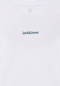 White cotton t-shirt featuring a crew neckline and blue text logo "Jack&Jones" on the front, with a smooth texture and standard fit.