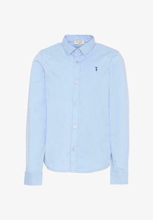 Chemise bleu clair à manches longues, avec boutons et col, petit logo bleu foncé sur le côté gauche de la poitrine, présentée sur fond blanc.