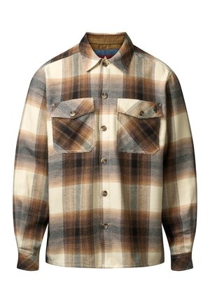 Chemise à manches longues avec un motif écossais marron, noir et crème, dotée de deux poches poitrine à rabat avec des boutons.