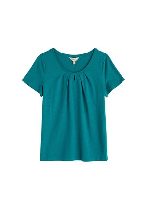 Tyrkysový krátky rukáv dámske tričko s výstrihom do U a malým otvorom pod líniou krku.