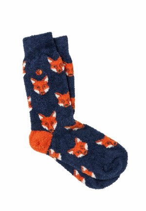 Calcetines azul marino peludos con talón naranja y múltiples caras de zorro naranja estampadas en la tela.