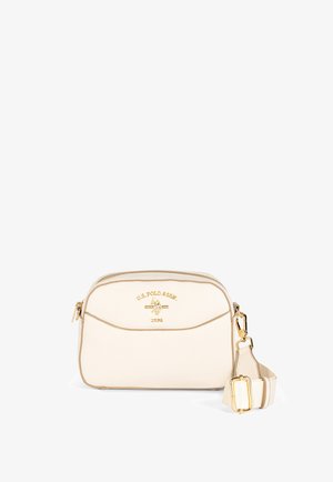 Crèmekleurige crossbodytas van U.S. Polo Assn. met gouden logo, ritssluiting en verstelbare riem met goudkleurige gesp en sluitingen.