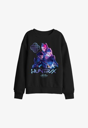 Black sweatshirt featuring three animated female characters with futuristic outfits, the word "HUNTRAX," and "K-POP DEMON HUNTERS" text.
