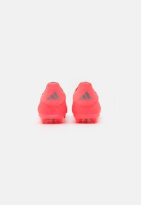 adidas Performance F50 LEAGUE LACELESS FIRM/MULTI-GROUND - Botines de fútbol para terreno firme - turbo/aurora black/platin metallic