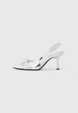 Silver slingback heels with a pointed toe, glossy finish, and a rectangular accent on the front, featuring a slim heel and adjustable strap.