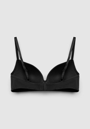 Reggiseno imbottito nero con spalline regolabili e chiusura sul retro con gancetti, mostrato disteso su uno sfondo grigio chiaro.