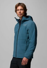 Türkise isolierte Jacke mit Kapuze, durchgehendem Reißverschluss und zwei Fronttaschen. Mit glatter Textur und Stichdetails an den Ärmeln.