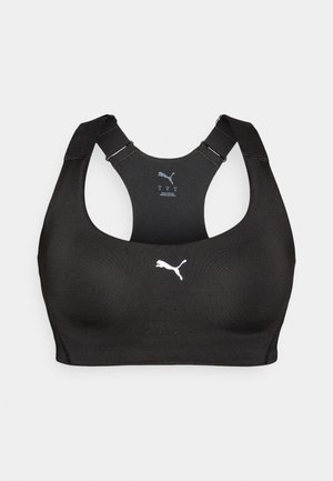 Soutien-gorge de sport noir Puma avec un design dos nageur, des bretelles réglables et des trous de ventilation perforés sur le panneau avant.