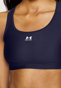 Under Armour HEATGEAR MID PADLESS - Sujetadores deportivos con sujeción media - midnight navy/white