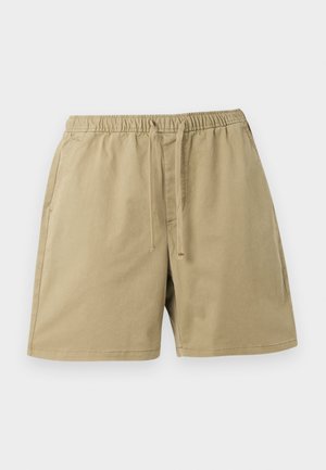 Shorts en coton beige avec taille élastique, cordon de serrage à l'avant, poches latérales et ourlet droit sur fond gris clair.