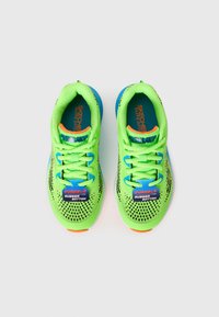 Green athletic shoes with a breathable mesh upper, blue accents, durable rubber outsole, and patterned design. Laces and branded labels included.