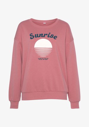 Light pink sweatshirt with a loose fit, round neckline, and long sleeves. Features a white sun graphic and navy blue text. Soft fabric.