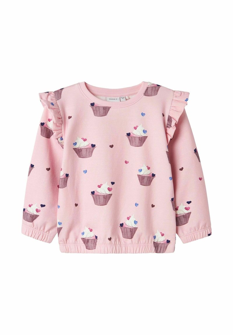T-shirt rose à manches longues pour tout-petit avec motifs de cupcakes et de cœurs, avec des détails à volants aux épaules et des poignets et ourlet élastiques.