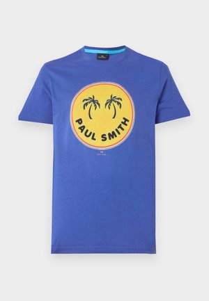 T-shirt en coton à col rond, bleu vif, avec un graphique rond jaune présentant des palmiers et le texte "PAUL SMITH". Manches courtes, coupe régulière.