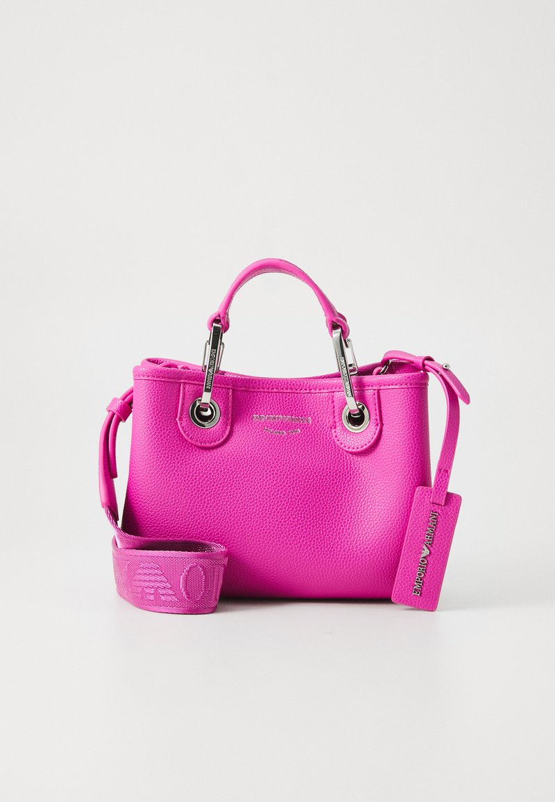Bright pink leather handbag with top handle, branded metal details, adjustable shoulder strap, and Emporio Armani tag against a white background.