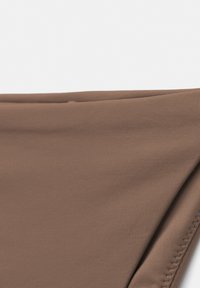 Brown bikini bottom made of smooth, stretchy fabric with a seam along the edges. Features a simple, clean design without patterns.