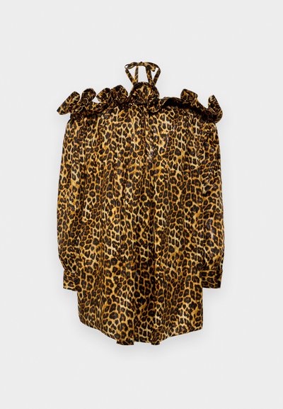 Pusero leopardikuvioisella printillä, röyhelökauluksella, satiinimaista materiaalia, pitkät hihat ja solmittava suljenta takana. Hallitsevat värit ovat keltainen, musta ja ruskea.