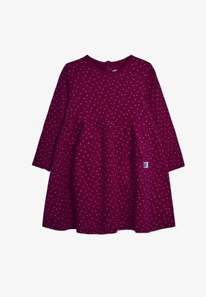 Bordowa sukienka z długimi rękawami, okrągłym dekoltem, rozrzuconymi jasnoróżowymi kropkami, rozkloszowanym dołem oraz małą kieszonką po lewej stronie.