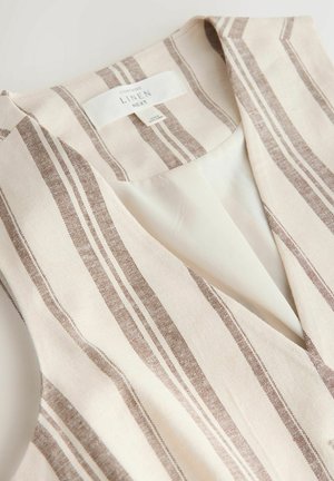 Beige and brown striped linen vest with a V-neck and inner white lining, folded flat showing the neck label.