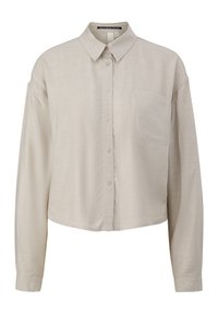 Beige, cropped button-up shirt with a collar, long sleeves, and a front pocket. Made of textured fabric with a subtle weave pattern.