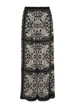 Pantalons larges noirs avec une taille élastique, présentant un motif floral blanc détaillé et des accents géométriques sur l'ensemble du tissu.