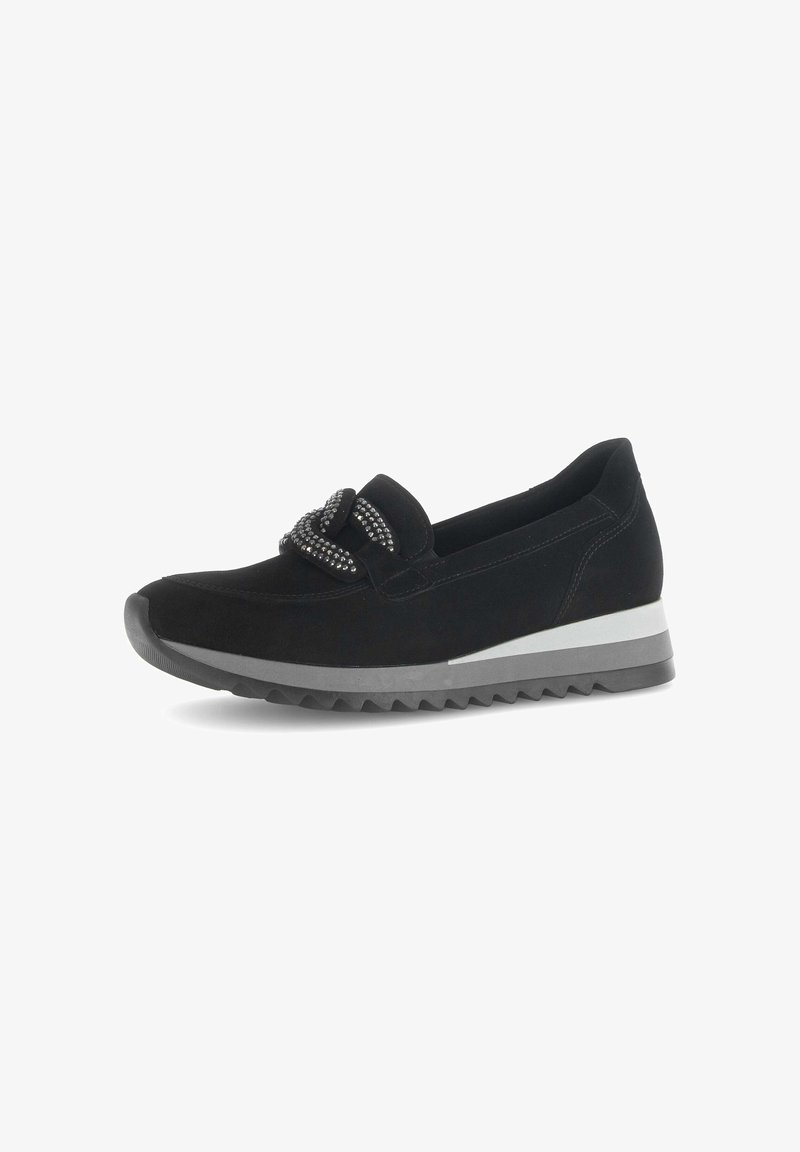 Black suede slip-on shoe with a textured knot detail, a white and gray layered sole, and a rounded toe design.