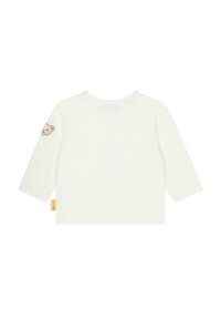 Witte, lange mouw katoenen blouse met een ronde hals en een geborduurd schaap op de linkermouw. Label aan de onderzijde.