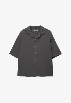 Short-sleeve, button-up shirt in dark gray fabric. Features a camp collar, straight cut, and subtle texture. Five buttons down the front.