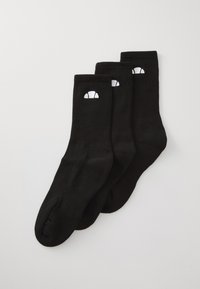 Drei Paare schwarzer Crew-Socken mit gerippten Bündchen und einem kleinen weißen Croissant-Logo nahe der Oberseite, flach auf einer weißen Oberfläche ausgelegt.
