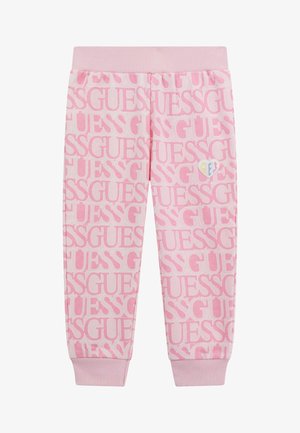 Roza trenirka z ponovljenim vzorcem logotipa "GUESS", rebrastim pasom in manšeti. Majhen večbarven srčkast logotip kot dodatek na strani.