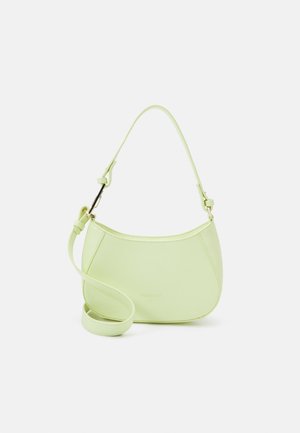 Light green crescent-shaped handbag with short handle and detachable long strap, displayed against a plain white background.