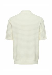 Polo à manches courtes en blanc cassé, fabriqué en tissu texturé avec un motif côtelé subtil. Doté d'un col ouvert et de bords élastiqués.